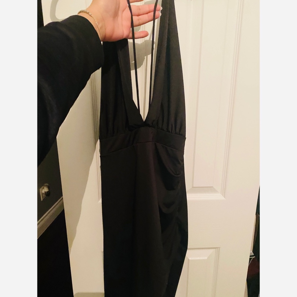 Backless, low cut mini black dress.